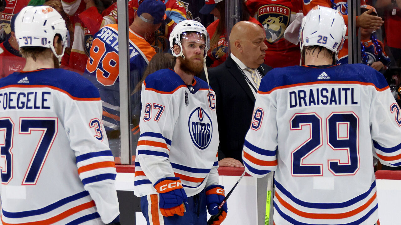 SUNRISE, FLORIDA - JUNE 24: Connor McDavid #97 of the Edmonton Oilers waits for teammates Warren Foegele #37 and Leon Draisaitl #29 before leaving the ice after Game Seven of the 2024 Stanley Cup Final between the Edmonton Oilers and the Florida Panthers at Amerant Bank Arena on June 24, 2024 in Sunrise, Florida.