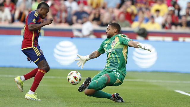 SANDY, UT - MAY 18: Goalkeeper Zack Steffen #95 of the Colorado Rapids gets a hand on a shot by Andres Gomez #11 of Real Salt Lake during the first half of their game at America First Field on May 18, 2024 in Salt Lake City, Utah.