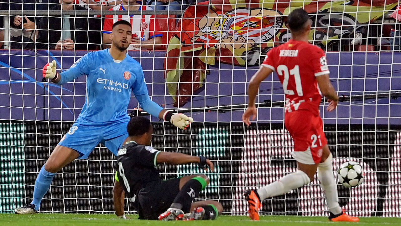 Girona's Venezuelan midfielder #21 Yangel Herrera scores an own goal during the UEFA Champions League, league phase day 2 football match between Girona FC and Feyenoord at the Montilivi stadium in Girona on October 2, 2024.