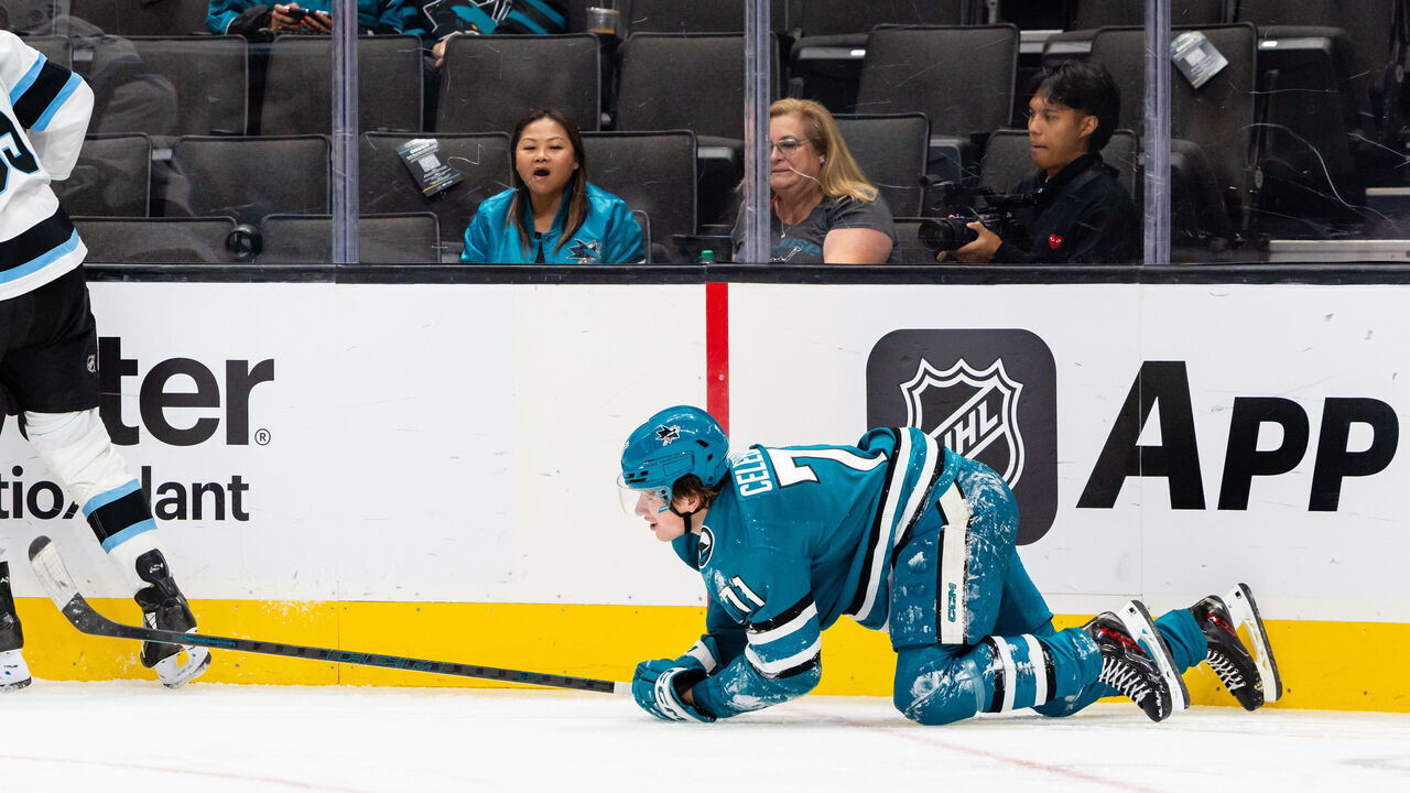 SAN JOSE, CA - OCTOBER 01: San Jose Sharks center Macklin Celebrini (71) gets up from the ice during a preseason NHL game between the Utah Hockey Club and the San Jose Sharks on October 1, 2024 at SAP Center at San Jose in San Jose, CA.