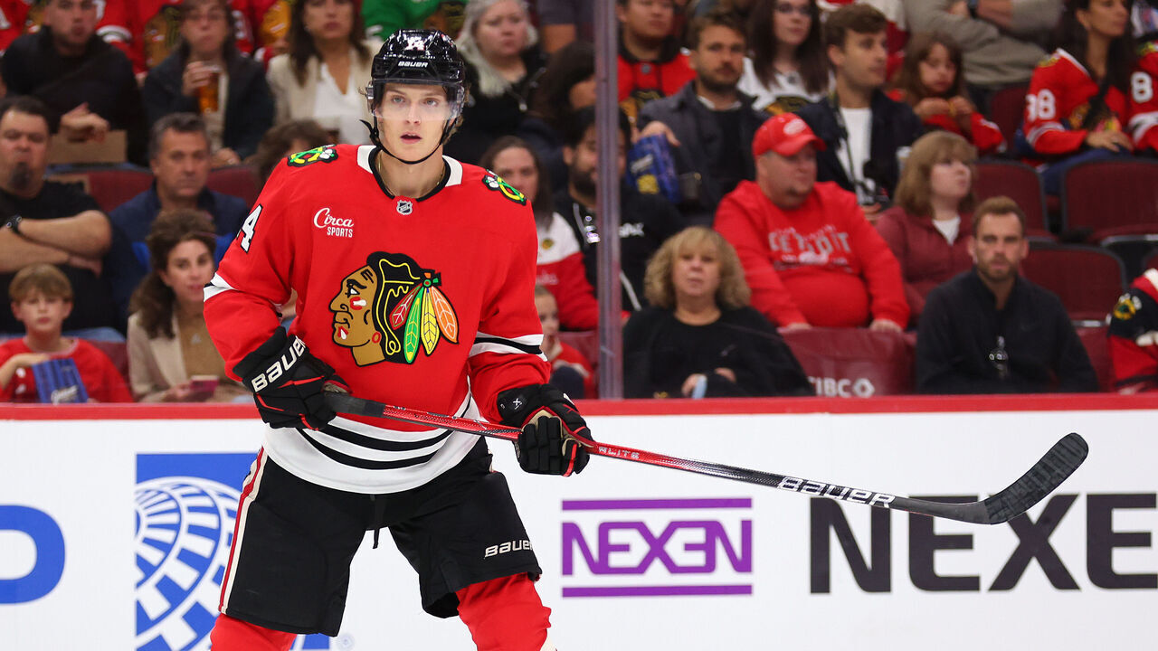 CHICAGO, ILLINOIS - SEPTEMBER 25: Kevin Korchinski #14 of the Chicago Blackhawks skates against the Detroit Red Wings during the second period of a preseason game at the United Center on September 25, 2024 in Chicago, Illinois.