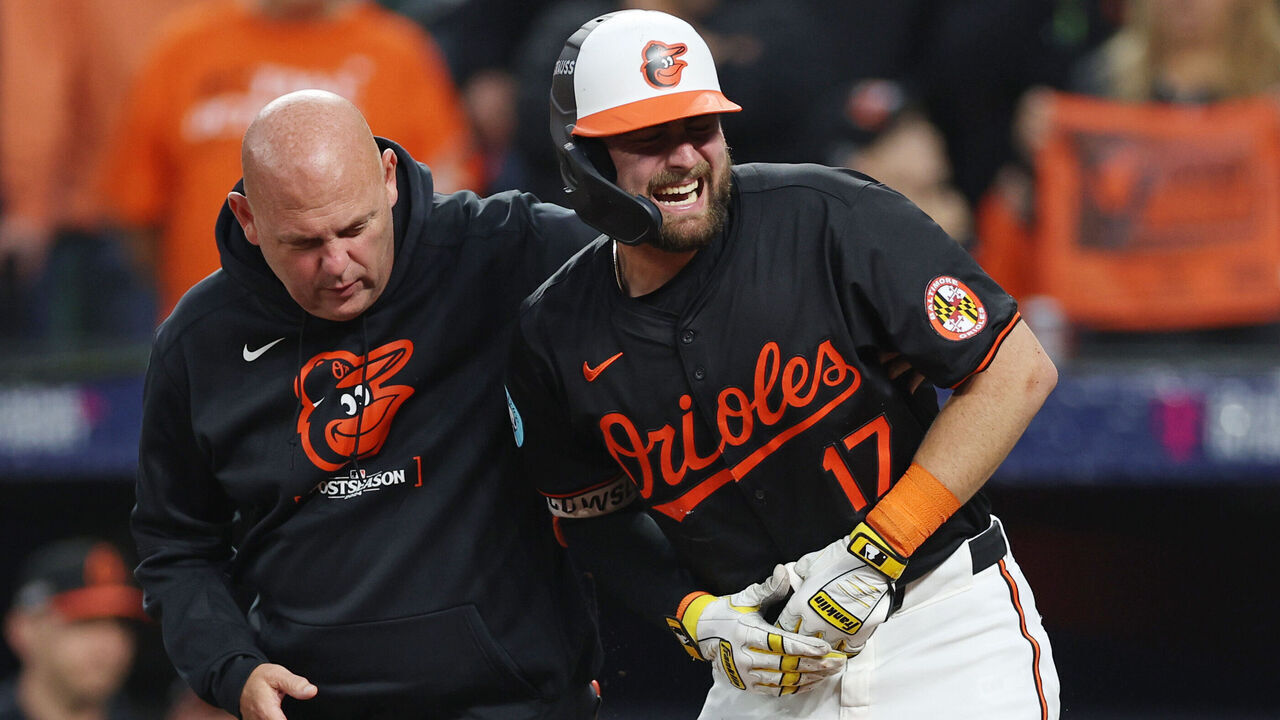 BALTIMORE, MARYLAND - OCTOBER 02: Colton Cowser #17 of the Baltimore Orioles reacts after being hit by a pitch as he strikes out against the Kansas City Royals during the fifth inning of Game Two of the Wild Card Series at Oriole Park at Camden Yards on October 02, 2024 in Baltimore, Maryland.