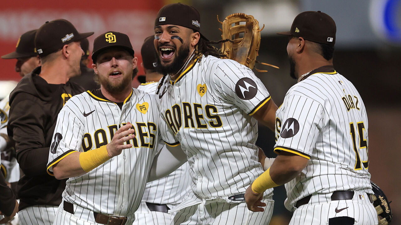 SAN DIEGO, CALIFORNIA - OCTOBER 02: Jake Cronenworth #9, Fernando Tatis Jr. #23 and Elias Díaz #15 of the San Diego Padres celebrate after defeating the Atlanta Braves in Game Two to win the Wild Card Series at Petco Park on October 02, 2024 in San Diego, California.
