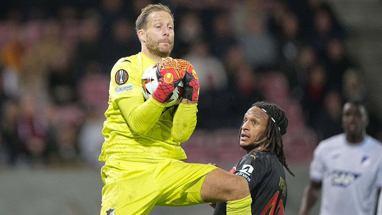 Hoffenheim's German goalkeeper #01 Oliver Baumann makes a save during the UEFA Europa League football match between FC Midtjylland and TSG 1899 Hoffenheim in Herning, Denmark on September 25, 2024.