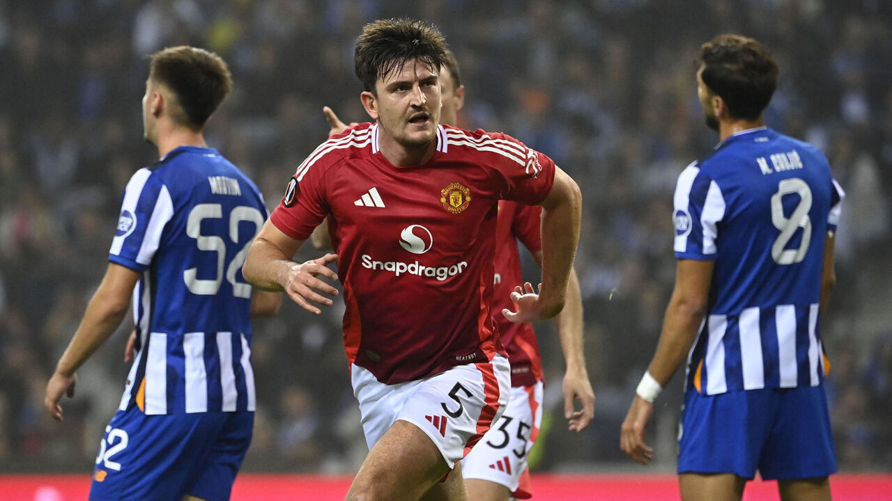 Manchester United's English defender #05 Harry Maguire celebrates scoring his team's third goal during the UEFA Europa League 1st round day 2 between FC Porto and Manchester United at the Dragao stadium in Porto on October 3, 2024.