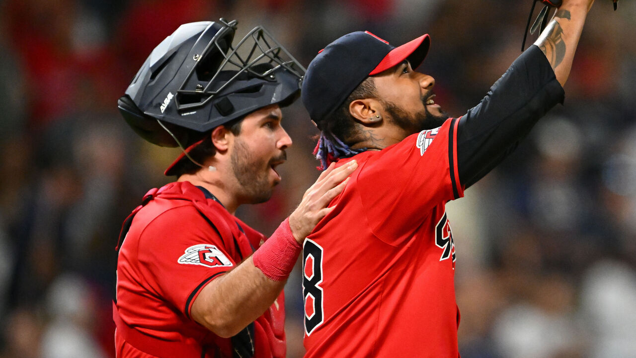CLEVELAND, OHIO - SEPTEMBER 16: Catcher Austin Hedges #27 of the Cleveland Guardians celebrates with closing pitcher Emmanuel Clase #48 after the Guardians defeat the Minnesota Twins at Progressive Field on September 16, 2024 in Cleveland, Ohio. The Guardians won 4-3.