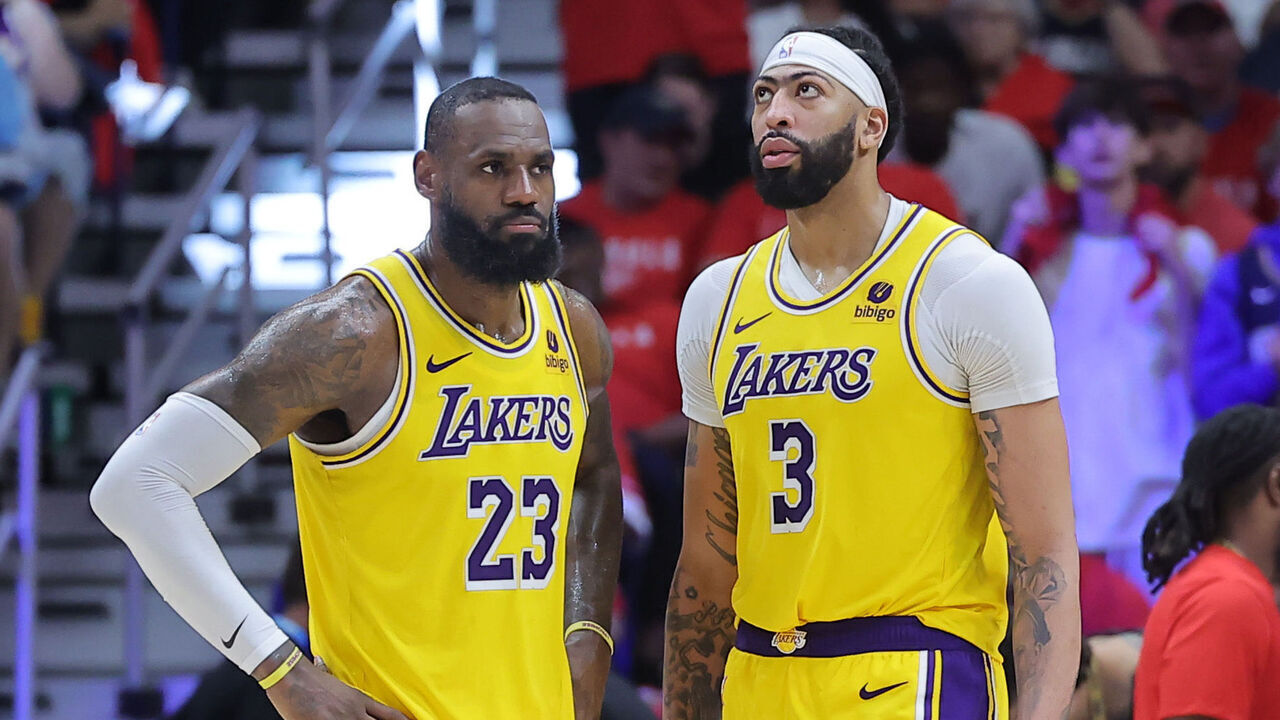 NEW ORLEANS, LOUISIANA - APRIL 16: LeBron James #23 and Anthony Davis #3 of the Los Angeles Lakers reacts against the New Orleans Pelicans during a play-in tournament game at the Smoothie King Center on April 16, 2024 in New Orleans, Louisiana.
