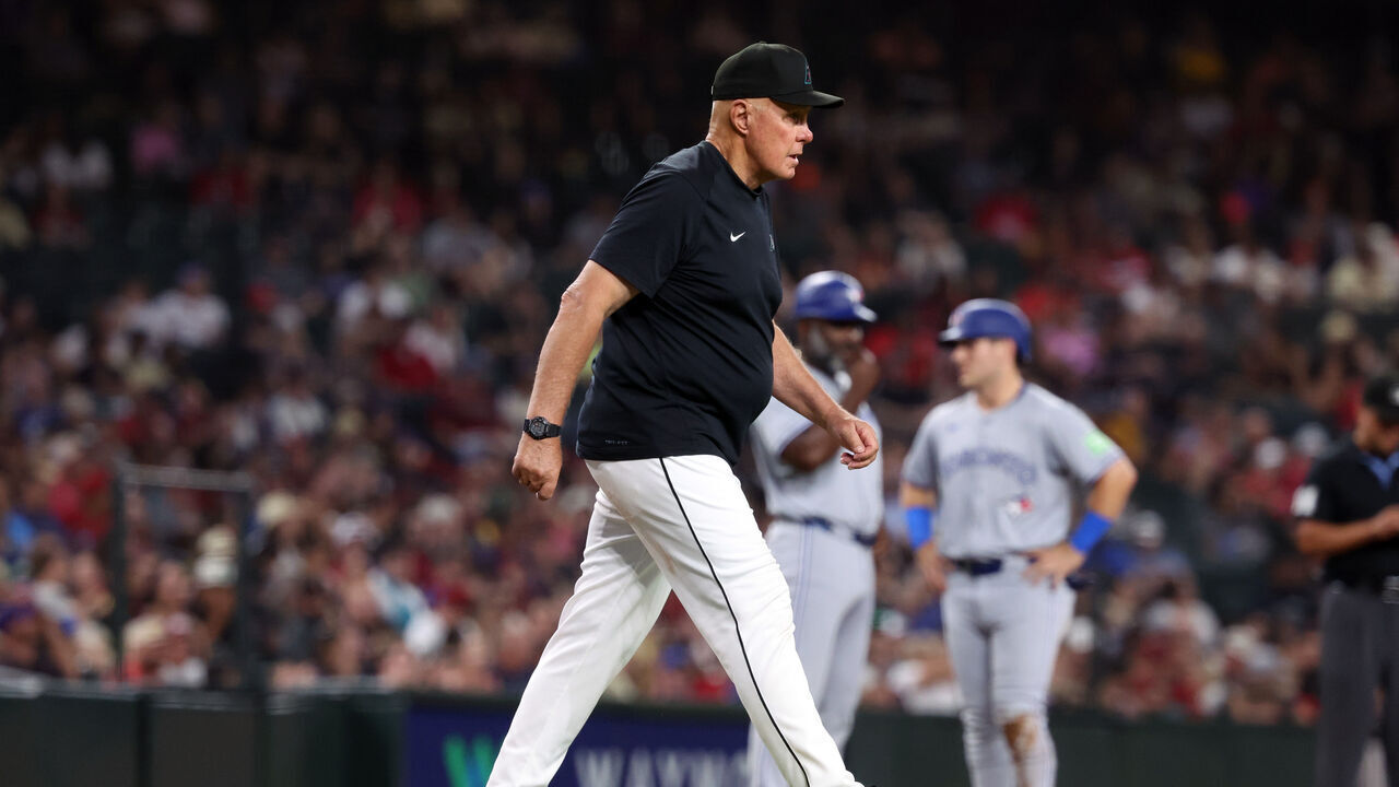 PHOENIX, ARIZONA - JULY 12: Pitching coach Brent Strom #72 of the Arizona Diamondbacks walks to the mound during the game against the Toronto Blue Jays at Chase Field on July 12, 2024 in Phoenix, Arizona. The Diamondbacks defeated the Blue Jays 5-4.