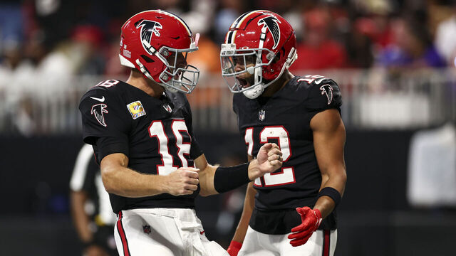 ATLANTA, GEORGIA - OCTOBER 3: Kirk Cousins #18 of the Atlanta Falcons celebrates with KhaDarel Hodge #12 after scoring a touchdown during the second quarter of an NFL football game against the Tampa Bay Buccaneers at Mercedes-Benz Stadium on October 3, 2024 in Atlanta, Georgia.
