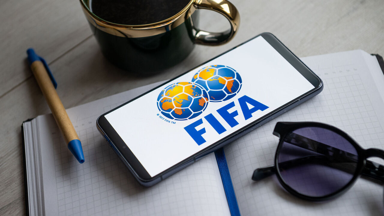 POLAND - 2024/01/31: In this photo illustration a FIFA logo seen displayed on a smartphone. (Photo Illustration by Mateusz Slodkowski/SOPA Images/LightRocket via Getty Images)