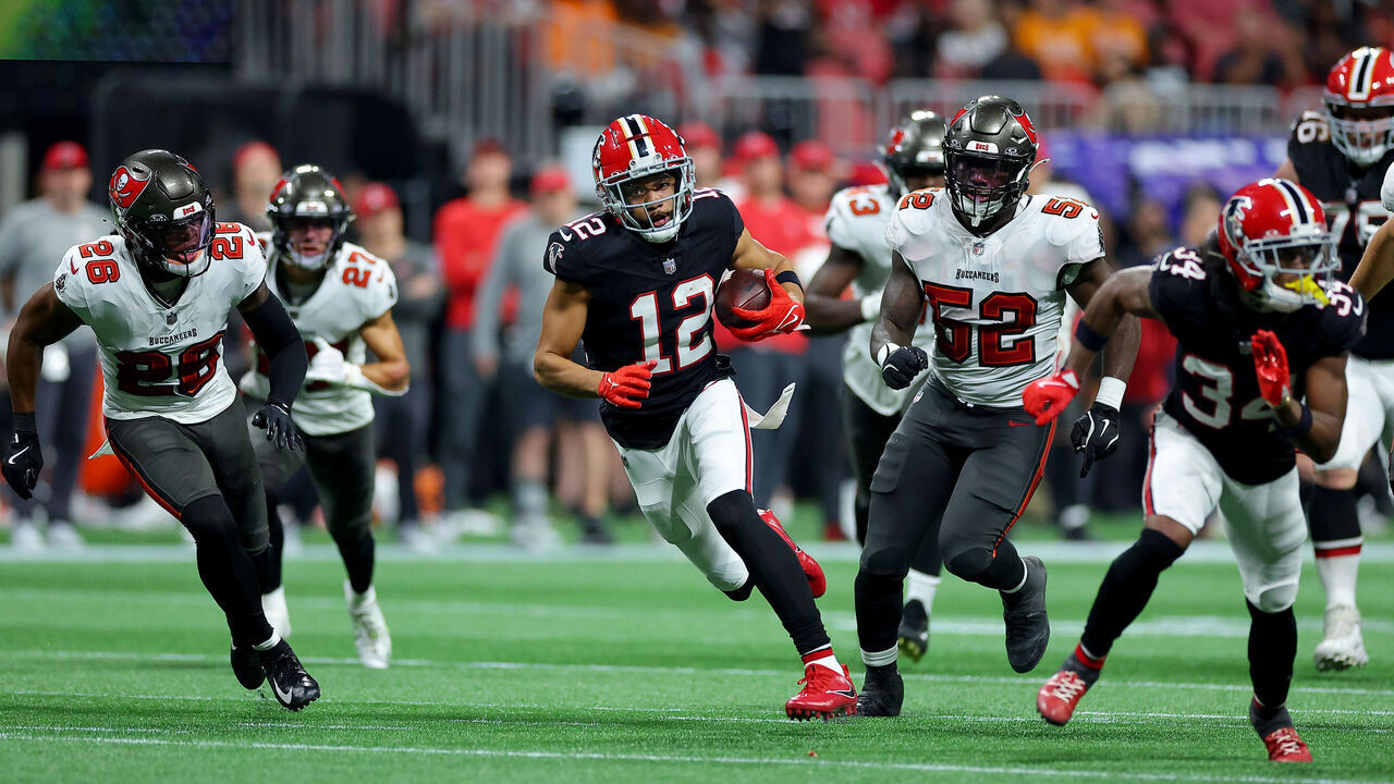 ATLANTA, GEORGIA - OCTOBER 03: KhaDarel Hodge #12 of the Atlanta Falcons runs with the ball to score a game winning 45 yard touchdown against the Tampa Bay Buccaneers during overtime at Mercedes-Benz Stadium on October 03, 2024 in Atlanta, Georgia.