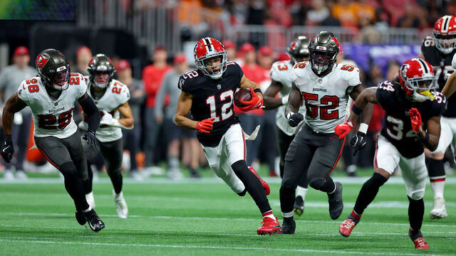 ATLANTA, GEORGIA - OCTOBER 03: KhaDarel Hodge #12 of the Atlanta Falcons runs with the ball to score a game winning 45 yard touchdown against the Tampa Bay Buccaneers during overtime at Mercedes-Benz Stadium on October 03, 2024 in Atlanta, Georgia.