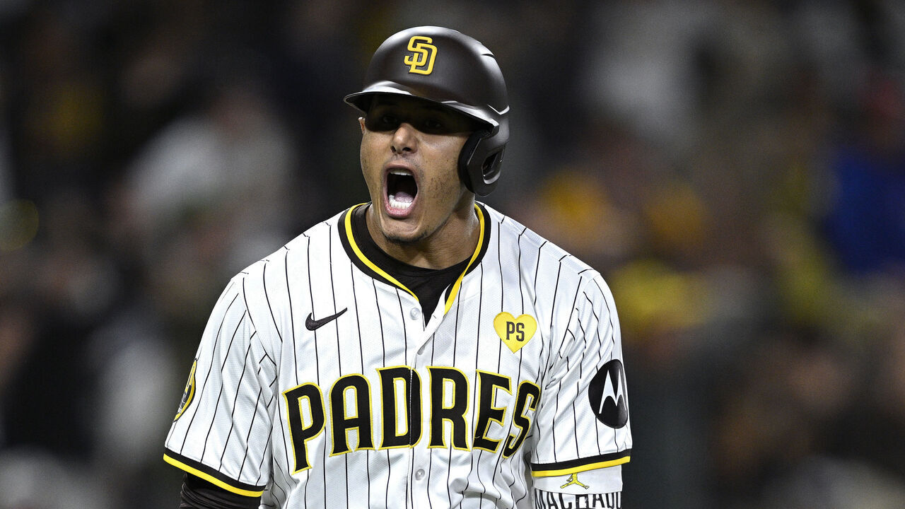 SAN DIEGO, CALIFORNIA - JULY 30: Manny Machado #13 of the San Diego Padres celebrates after hitting a home run against the Los Angeles Dodgers during the ninth inning at Petco Park on July 30, 2024 in San Diego, California.