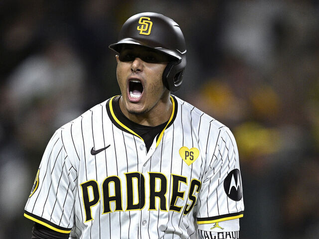 SAN DIEGO, CALIFORNIA - JULY 30: Manny Machado #13 of the San Diego Padres celebrates after hitting a home run against the Los Angeles Dodgers during the ninth inning at Petco Park on July 30, 2024 in San Diego, California.
