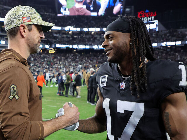 LAS VEGAS, NEVADA - NOVEMBER 12: Quarterback Aaron Rodgers #8 of the New York Jets talks with wide receiver Davante Adams #17 of the Las Vegas Raiders after the Raiders defeated the Jets to win the game at Allegiant Stadium on November 12, 2023 in Las Vegas, Nevada.