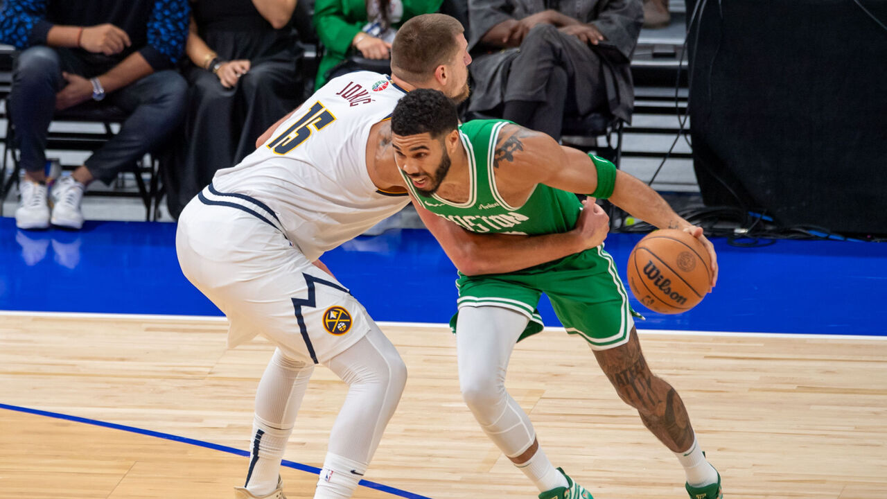 ABU DHABI, UNITED ARAB EMIRATES - OCTOBER 04: Jayson Tatum (R) of Boston Celtics and Nikola Jokic (L) of Denver Nuggets in action during the NBA Preseason game between the Denver Nuggets and the Boston Celtics at the Etihad Arena in Abu Dhabi on October 04, 2023.