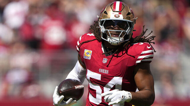 SANTA CLARA, CALIFORNIA - SEPTEMBER 29: Fred Warner #54 of the San Francisco 49ers runs with the ball after making an interception in the second quarter against the New England Patriots at Levi's Stadium on September 29, 2024 in Santa Clara, California.