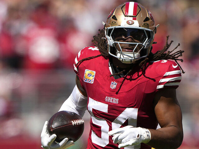 SANTA CLARA, CALIFORNIA - SEPTEMBER 29: Fred Warner #54 of the San Francisco 49ers runs with the ball after making an interception in the second quarter against the New England Patriots at Levi's Stadium on September 29, 2024 in Santa Clara, California.