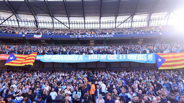 MANCHESTER, ENGLAND - OCTOBER 5: Manchester City fans display a banner featuring the Catalan flag urging Manchester City manager Pep Guardiola to stay during the Premier League match between Manchester City FC and Fulham FC at Etihad Stadium on October 5, 2024 in Manchester, England.