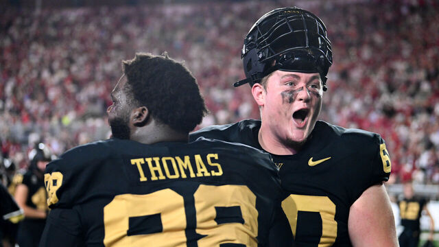 NASHVILLE, TENNESSEE - OCTOBER 5: Duncan MacDonald #60 and De'Marion Thomas #98 of the Vanderbilt Commodores celebrate their win against the Alabama Crimson Tide at FirstBank Stadium on October 5, 2024 in Nashville, Tennessee.