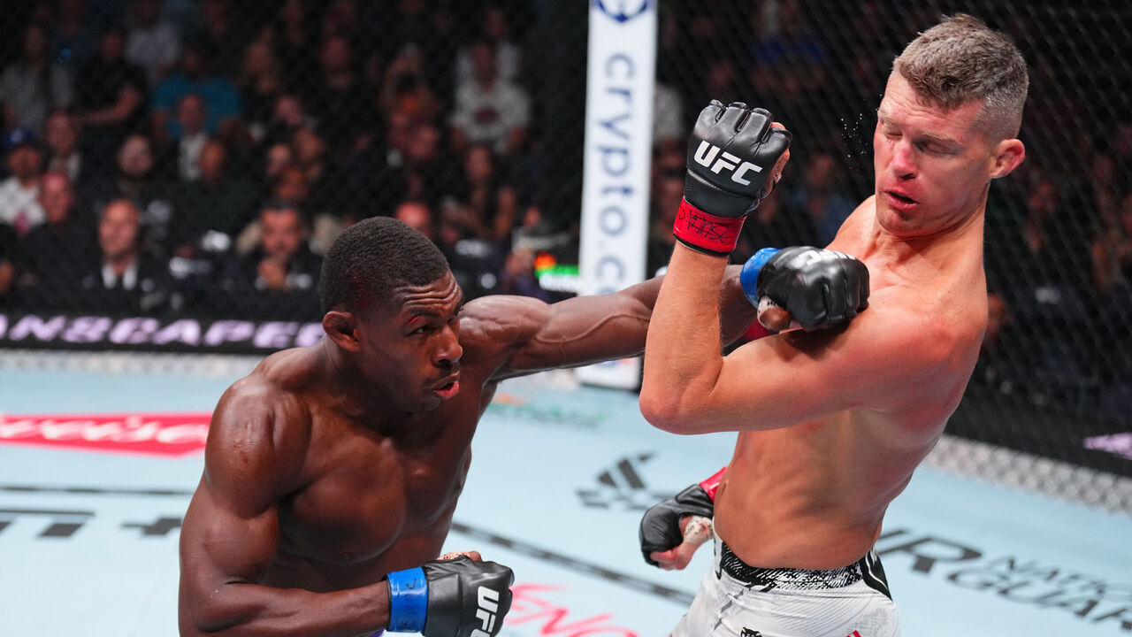 SALT LAKE CITY, UTAH - OCTOBER 05: (L-R) Joaquin Buckley punches Stephen Thompson in a welterweight fight during the UFC 307 event at Delta Center on October 05, 2024 in Salt Lake City, Utah.