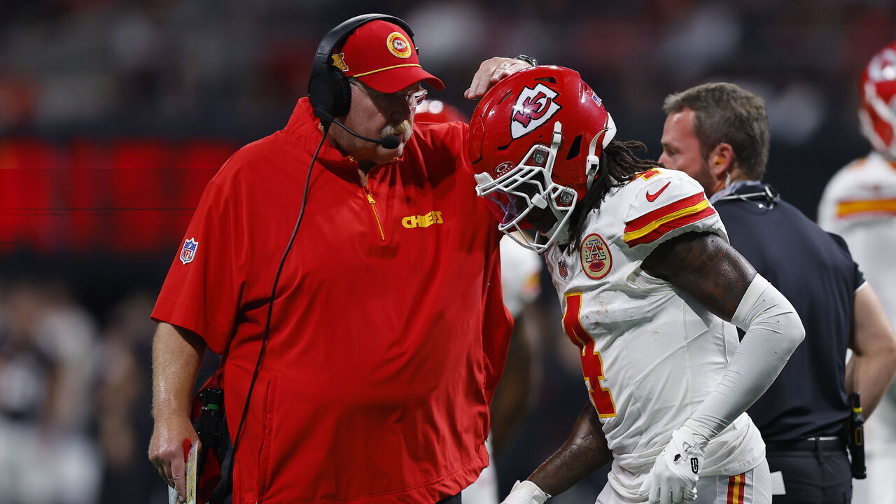ATLANTA, GEORGIA - SEPTEMBER 22: Head coach Andy Reid of the Kansas City Chiefs speaks with Rashee Rice #4 of the Kansas City Chiefs during the third quarter against the Atlanta Falcons at Mercedes-Benz Stadium on September 22, 2024 in Atlanta, Georgia.