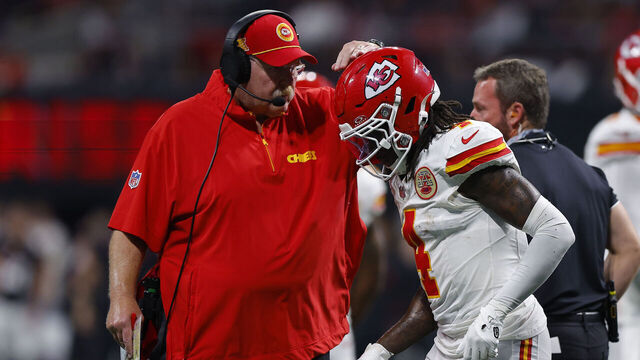 ATLANTA, GEORGIA - SEPTEMBER 22: Head coach Andy Reid of the Kansas City Chiefs speaks with Rashee Rice #4 of the Kansas City Chiefs during the third quarter against the Atlanta Falcons at Mercedes-Benz Stadium on September 22, 2024 in Atlanta, Georgia.