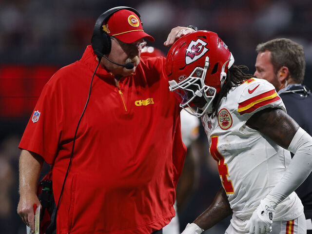 ATLANTA, GEORGIA - SEPTEMBER 22: Head coach Andy Reid of the Kansas City Chiefs speaks with Rashee Rice #4 of the Kansas City Chiefs during the third quarter against the Atlanta Falcons at Mercedes-Benz Stadium on September 22, 2024 in Atlanta, Georgia.