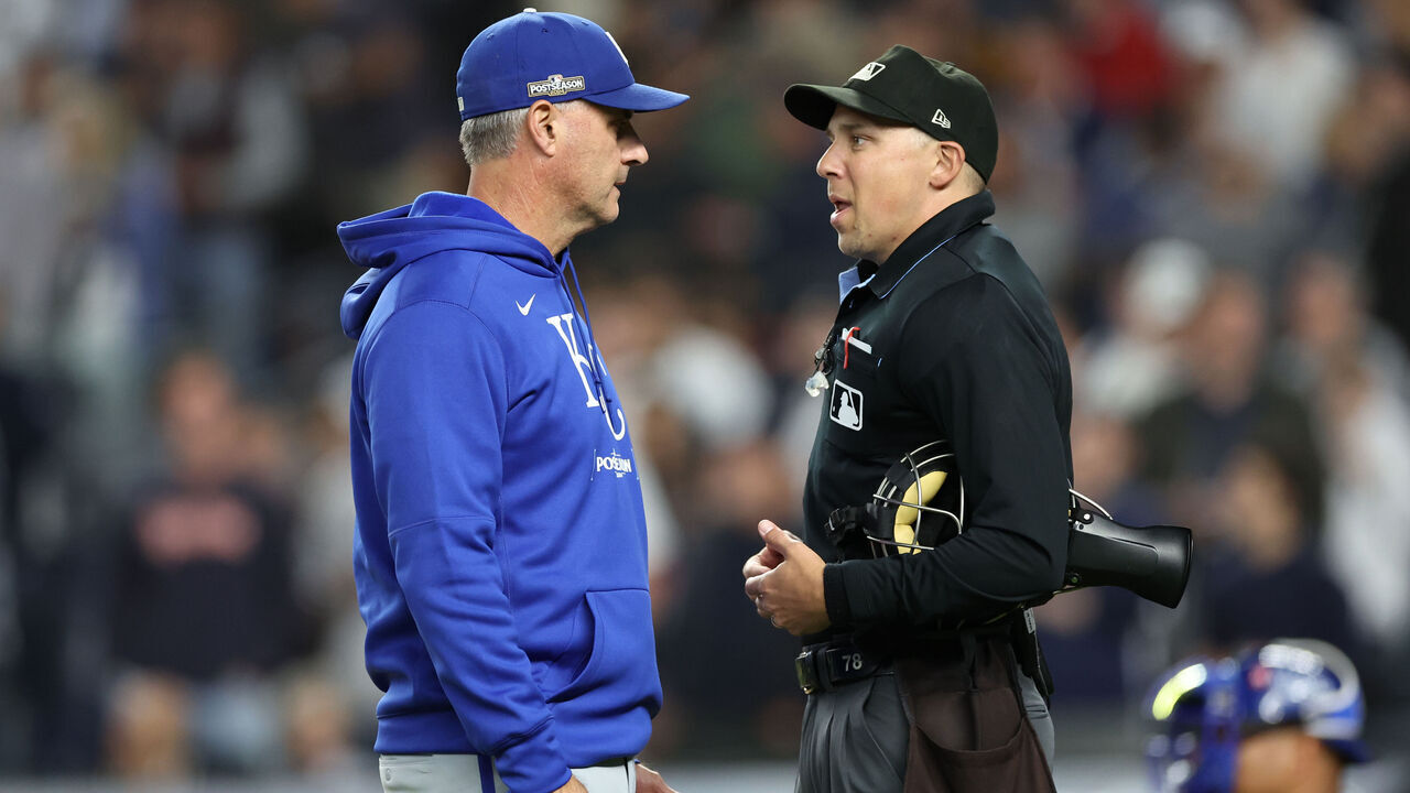 NEW YORK, NEW YORK - OCTOBER 05: Manager Matt Quatraro #33 of the Kansas City Royals discusses a call with umpire Adam Hamari #78 during the seventh inning against the New York Yankees in Game One of the Division Series at Yankee Stadium on October 05, 2024 in New York City.
