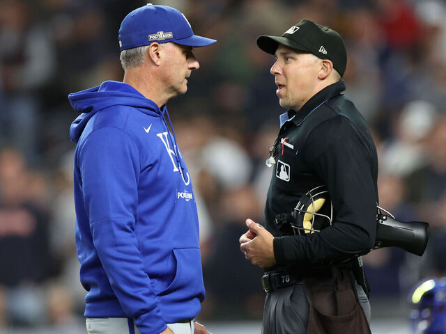 NEW YORK, NEW YORK - OCTOBER 05: Manager Matt Quatraro #33 of the Kansas City Royals discusses a call with umpire Adam Hamari #78 during the seventh inning against the New York Yankees in Game One of the Division Series at Yankee Stadium on October 05, 2024 in New York City.