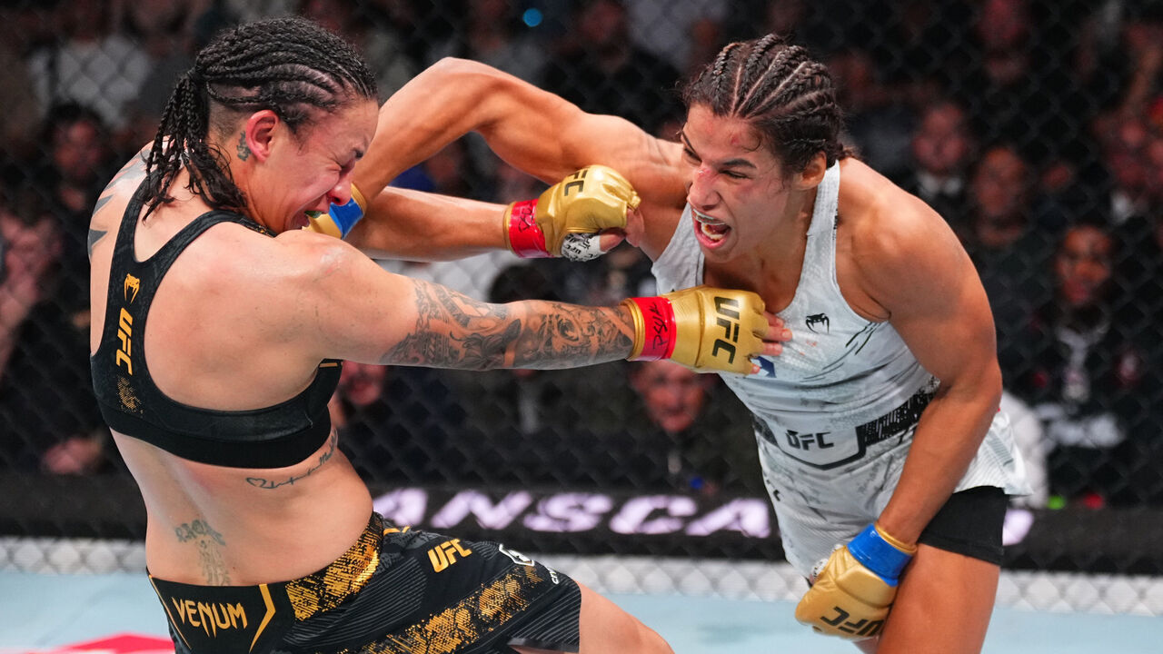 SALT LAKE CITY, UTAH - OCTOBER 05: (R-L) Julianna Pena punches Raquel Pennington in the UFC bantamweight championship fight during the UFC 307 event at Delta Center on October 05, 2024 in Salt Lake City, Utah.