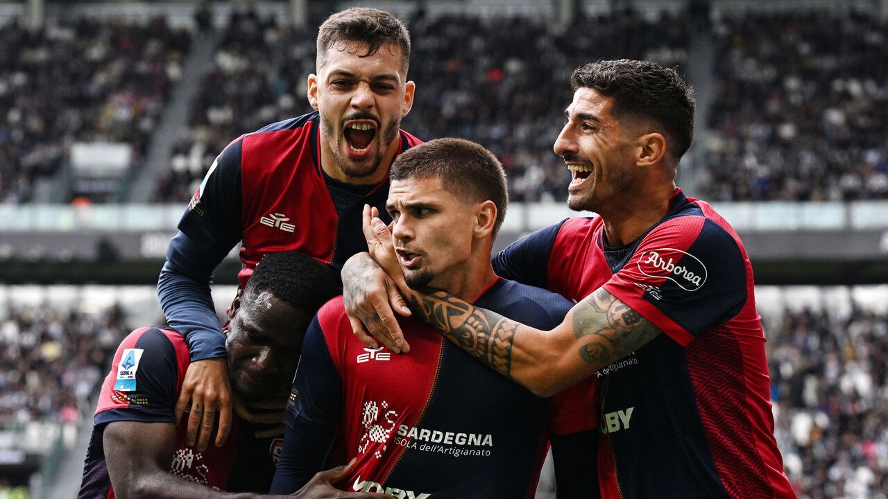 TURIN, ITALY - OCTOBER 06: Razvan Marin of Cagliari celebrates his gol with Gianluca Gaetano of Cagliari and Alessandro Deiola of Cagliari during the Serie A match between Juventus and Cagliari Calcio at on October 06, 2024 in Turin, Italy.