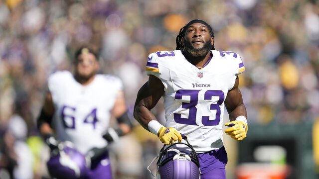 GREEN BAY, WISCONSIN - SEPTEMBER 29: Aaron Jones #33 of the Minnesota Vikings warms up before a game against the Green Bay Packers at Lambeau Field on September 29, 2024 in Green Bay, Wisconsin.