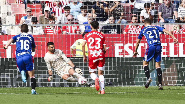 GIRONA, SPAIN - OCTOBER 06: Paulo Gazzaniga of Girona FC stops a penalty during the LaLiga match between Girona FC and Athletic Club at Montilivi Stadium on October 06, 2024 in Girona, Spain.