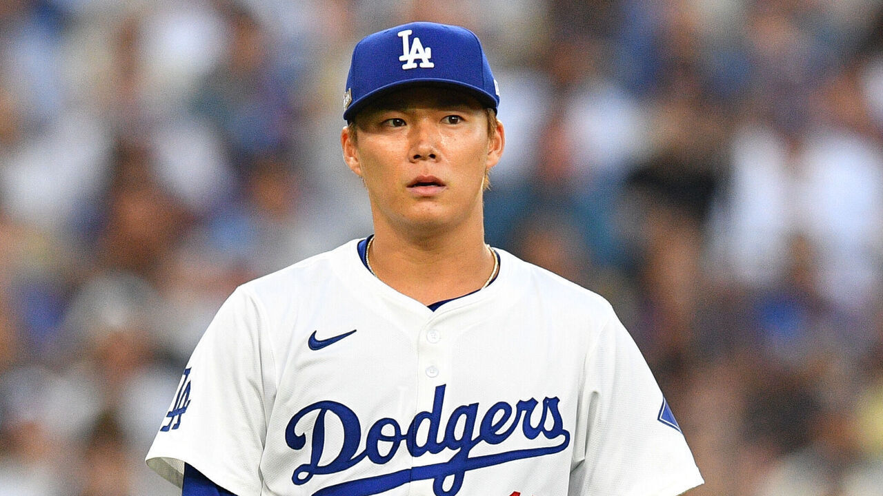 LOS ANGELES, CA - OCTOBER 05: Los Angeles Dodgers pitcher Yoshinobu Yamamoto (18) looks on during game one of the National League Division Series game between the San Diego Padres and the Los Angeles Dodgers on October 5, 2024 at Dodger Stadium in Los Angeles, CA.