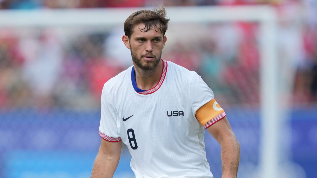 PARIS, FRANCE - AUGUST 02: Tanner Tessmann #8 of the United States passes the ball during the second half against Morocco during the Men's Quarter Final match during the Olympic Games Paris 2024 at Parc des Princes on August 02, 2024 in Paris, France.