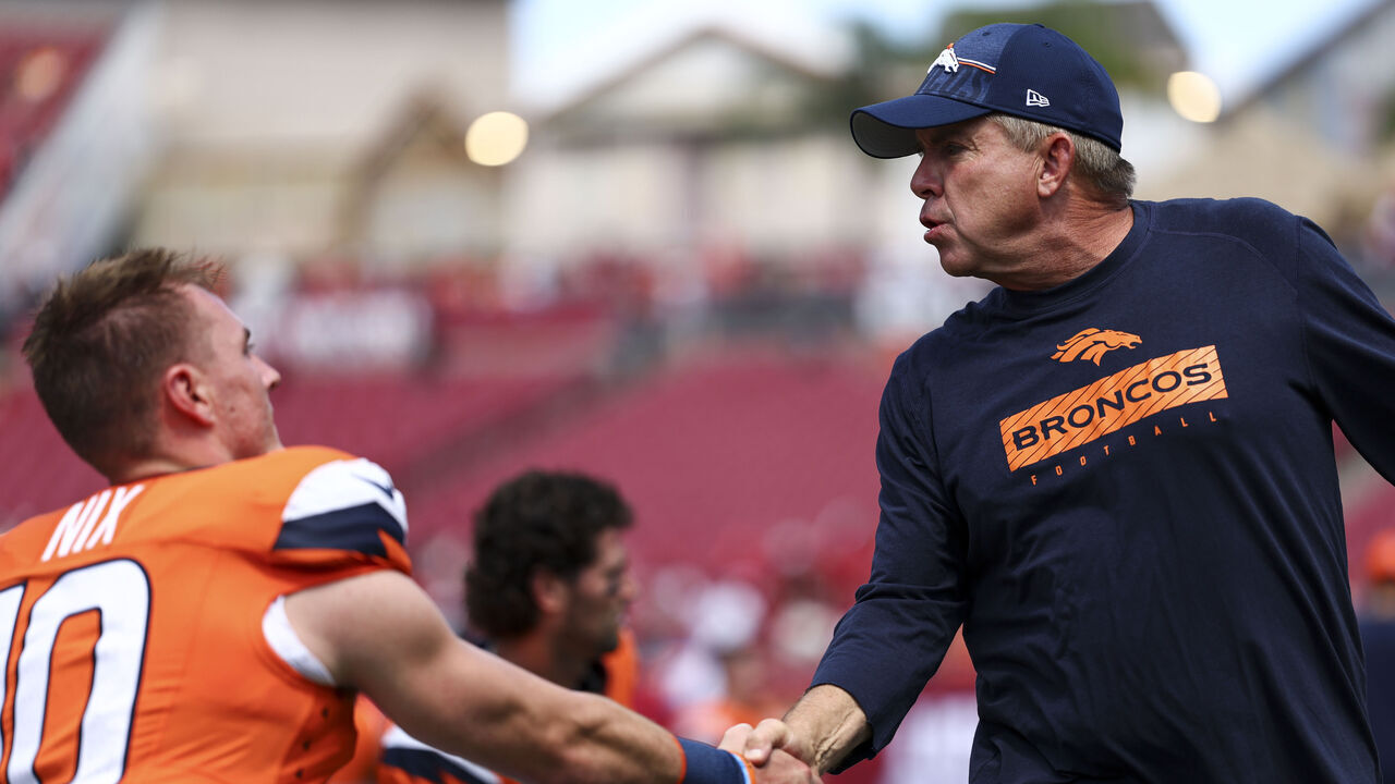 TAMPA, FL - SEPTEMBER 22: Head coach Sean Payton of the Denver Broncos shakes hands with Bo Nix #10 prior to an NFL football game against the Tampa Bay Buccaneers at Raymond James Stadium on September 22, 2024 in Tampa, Florida.