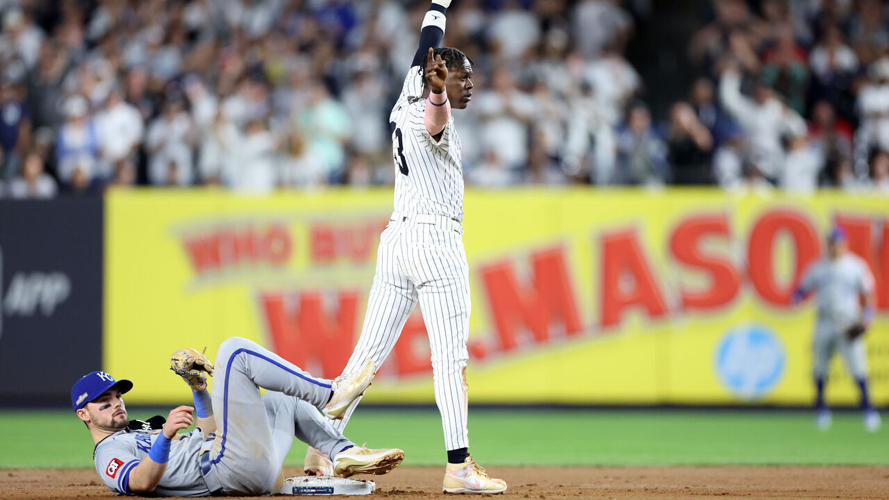 NEW YORK, NEW YORK - OCTOBER 05: Jazz Chisholm Jr. #13 of the New York Yankees reaches second base safely with a stolen base against Michael Massey #19 of the Kansas City Royals during the seventh inning in Game One of the Division Series at Yankee Stadium on October 05, 2024 in New York City.
