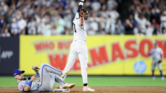 NEW YORK, NEW YORK - OCTOBER 05: Jazz Chisholm Jr. #13 of the New York Yankees reaches second base safely with a stolen base against Michael Massey #19 of the Kansas City Royals during the seventh inning in Game One of the Division Series at Yankee Stadium on October 05, 2024 in New York City.
