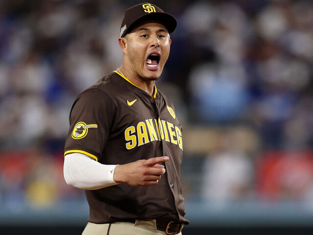 LOS ANGELES, CALIFORNIA - OCTOBER 06: Manny Machado #13 of the San Diego Padres reacts towards the Los Angeles Dodgers bench in the seventh inning during Game Two of the Division Series at Dodger Stadium on October 06, 2024 in Los Angeles, California.