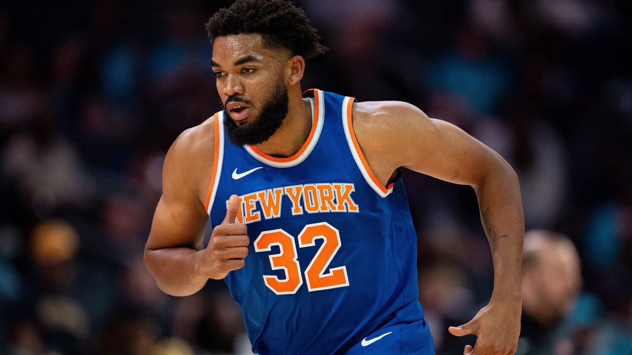 CHARLOTTE, NORTH CAROLINA - OCTOBER 06: Karl-Anthony Towns #32 of the New York Knicks runs down the court in the first quarter during a preseason game against the Charlotte Hornets at Spectrum Center on October 06, 2024 in Charlotte, North Carolina.