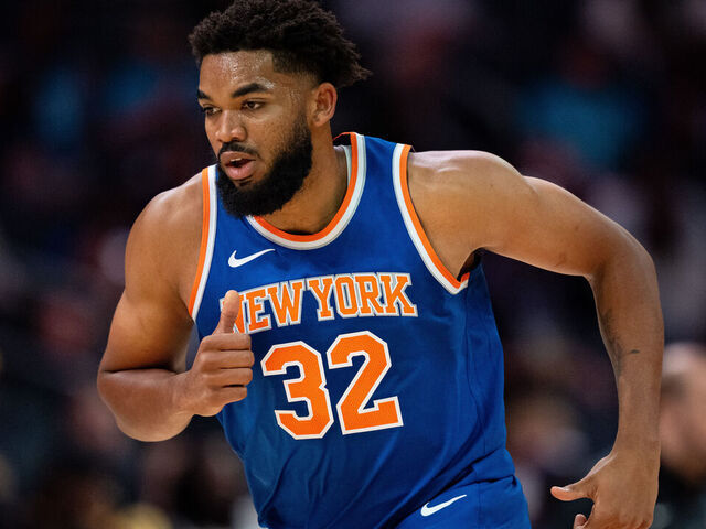 CHARLOTTE, NORTH CAROLINA - OCTOBER 06: Karl-Anthony Towns #32 of the New York Knicks runs down the court in the first quarter during a preseason game against the Charlotte Hornets at Spectrum Center on October 06, 2024 in Charlotte, North Carolina.