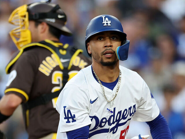 LOS ANGELES, CALIFORNIA - OCTOBER 06: Mookie Betts #50 of the Los Angeles Dodgers reacts after striking out in the third inning against the San Diego Padres during Game Two of the Division Series at Dodger Stadium on October 06, 2024 in Los Angeles, California.