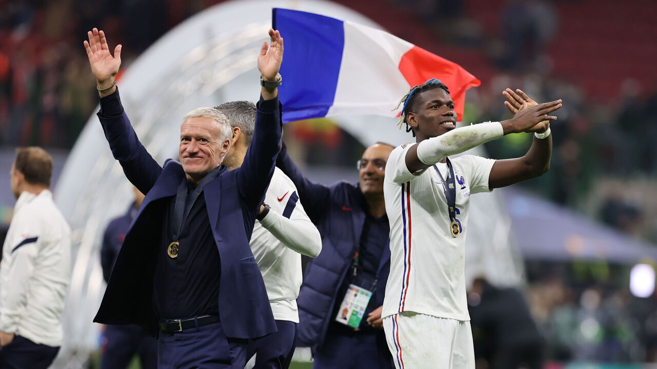 Paul Pogba of France and Didier Deschamps Head Coach of France celebrate the victory at the end of the match during the UEFA Nations League Finals 2021 final football match between Spain and France at Giuseppe Meazza Stadium, Milan, Italy on October 10, 2021