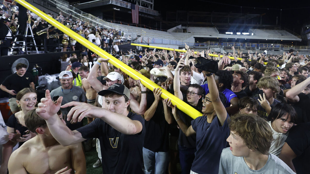 NASHVILLE, TN - OCTOBER 05: Vanderbilt Commodores fans march the goal posts around the field following a game between the Vanderbilt Commodores and Alabama Crimson Tide, October 5, 2024 at FirstBank Stadium in Nashville, Tennessee.