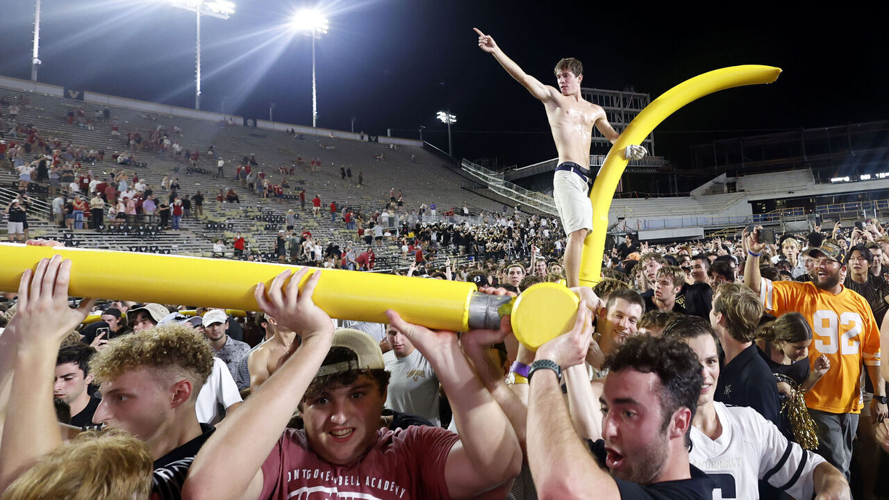 NASHVILLE, TN - OCTOBER 05: Vanderbilt Commodores fans march the goal posts around the field following a game between the Vanderbilt Commodores and Alabama Crimson Tide, October 5, 2024 at FirstBank Stadium in Nashville, Tennessee.