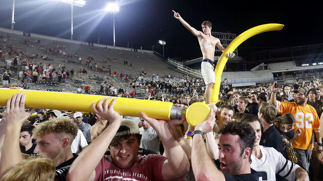 NASHVILLE, TN - OCTOBER 05: Vanderbilt Commodores fans march the goal posts around the field following a game between the Vanderbilt Commodores and Alabama Crimson Tide, October 5, 2024 at FirstBank Stadium in Nashville, Tennessee.