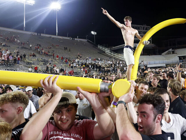 NASHVILLE, TN - OCTOBER 05: Vanderbilt Commodores fans march the goal posts around the field following a game between the Vanderbilt Commodores and Alabama Crimson Tide, October 5, 2024 at FirstBank Stadium in Nashville, Tennessee.