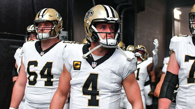 ATLANTA, GA SEPTEMBER 29: New Orleans players Nick Saldiveri (64), Derek Carr (4), and Trevor Penning (70) wait to enter the field prior to the start of the NFL game between the New Orleans Saints and the Atlanta Falcons on September 29th, 2024 at Mercedes-Benz Stadium in Atlanta, GA.
