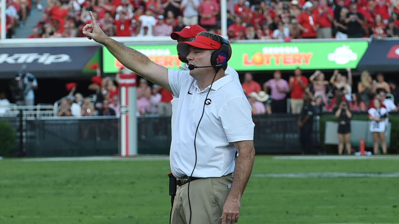 ATHENS, GA - OCTOBER 05: Georgia Bulldogs head coach Kirby Smart signals for an extra point during the college football game between the Auburn Tigers and the Georgia Bulldogs on October 05, 2024, at Sanford Stadium in Athens, GA.